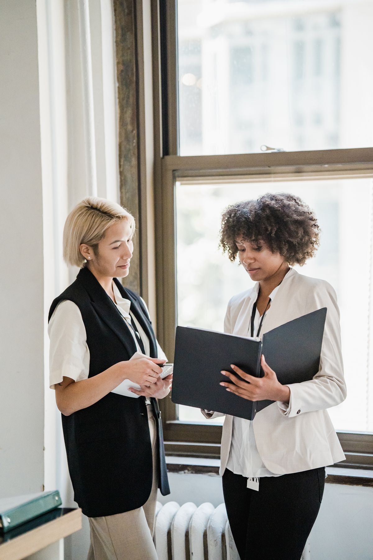 Consultants reviewing documents together